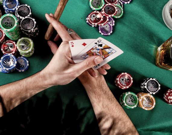 person holding a playing cards