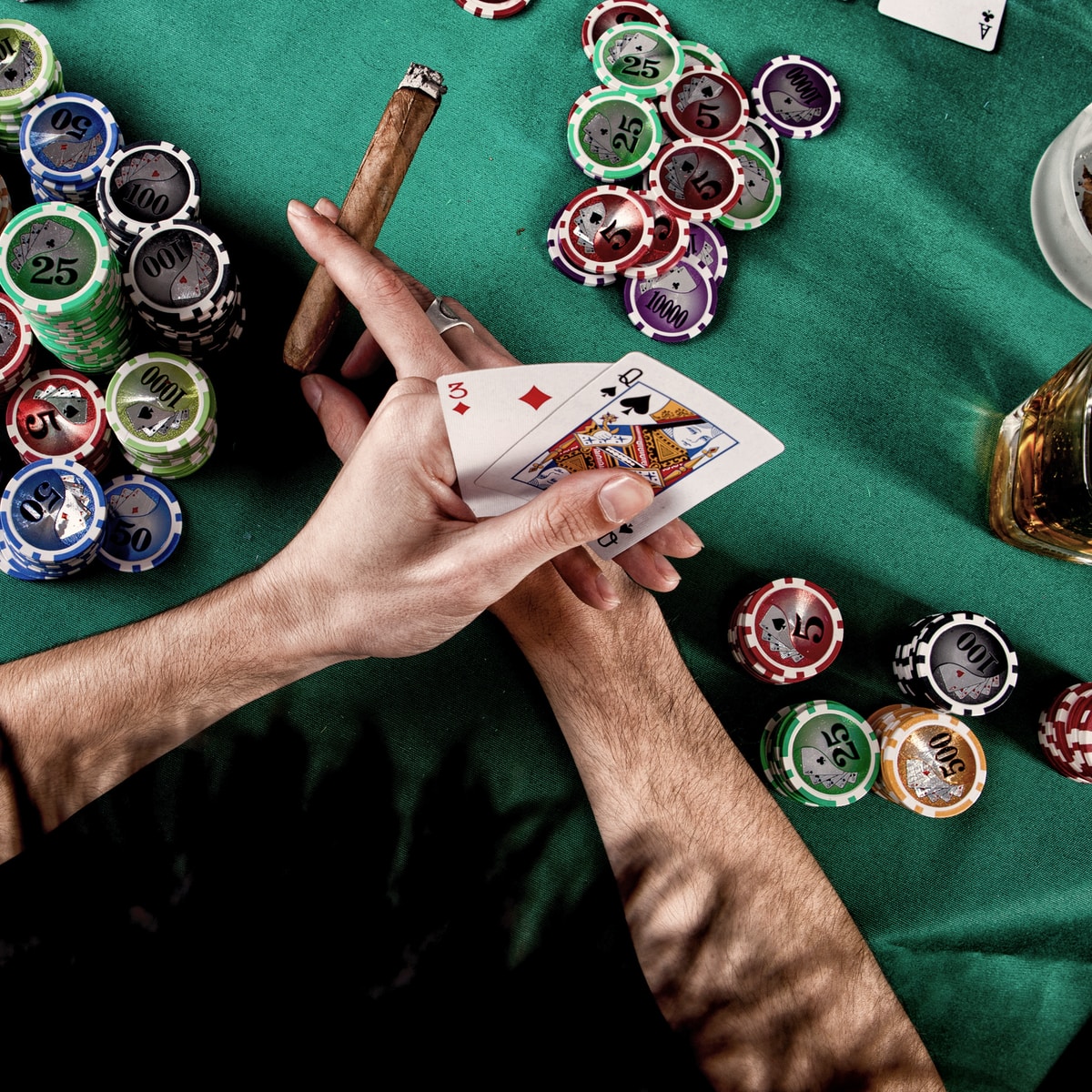 person holding a playing cards