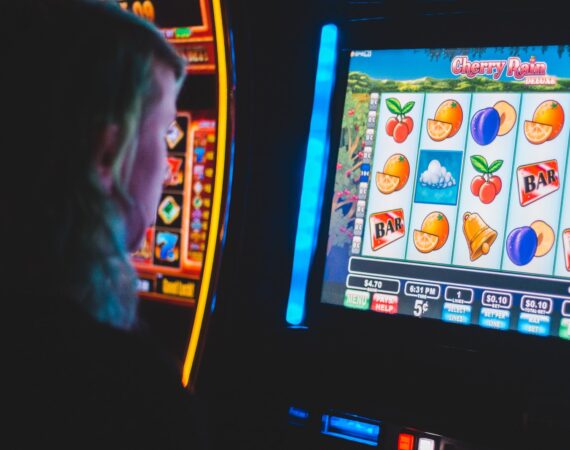man playing slot machine game